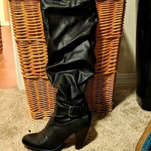Black knee high heeled boots